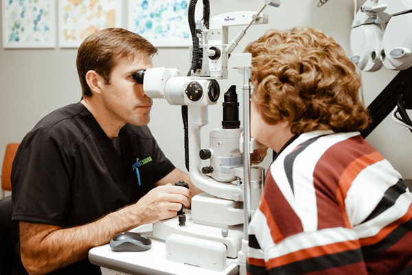 Eye doctor examining older patient at Jarvis Vision Center